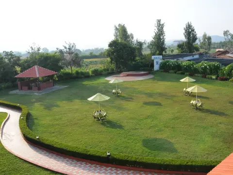 Lawn, outdoor seating and dance-floor area at Chikmagalur Catholic Club