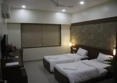 Twin-bed guest room at Deccan Gymkhana