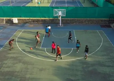Outdoor basketball court in use at Deccan Gymkhana