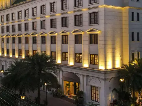 Clubhouse exterior at dusk — DLF Club 3