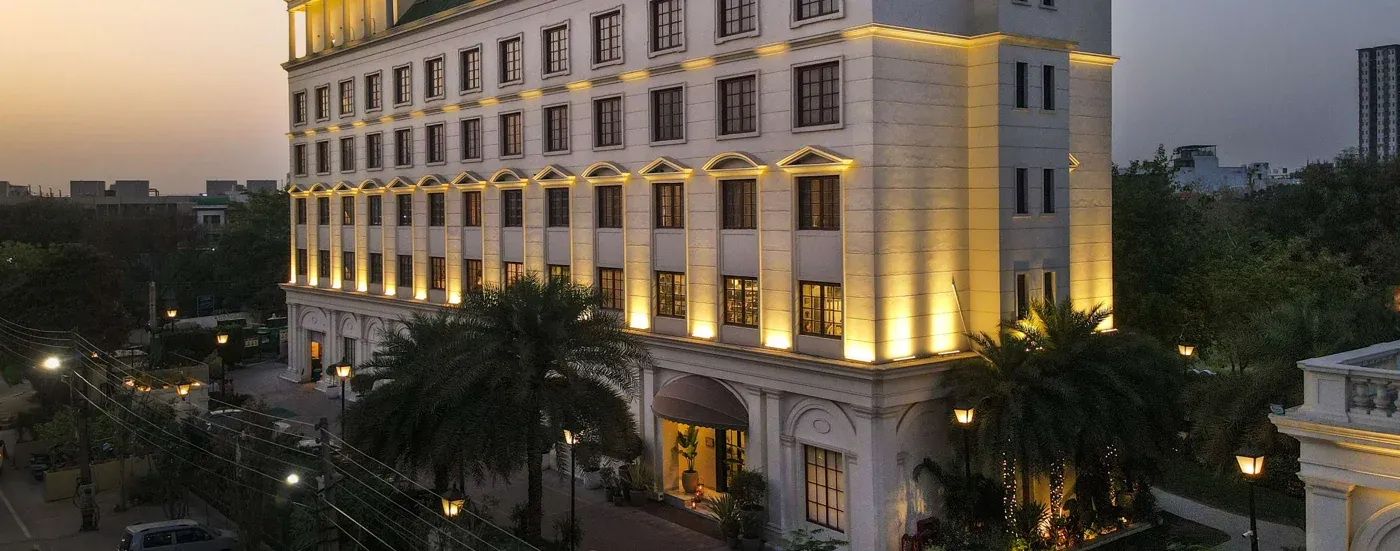 Clubhouse exterior at dusk — DLF Club 3