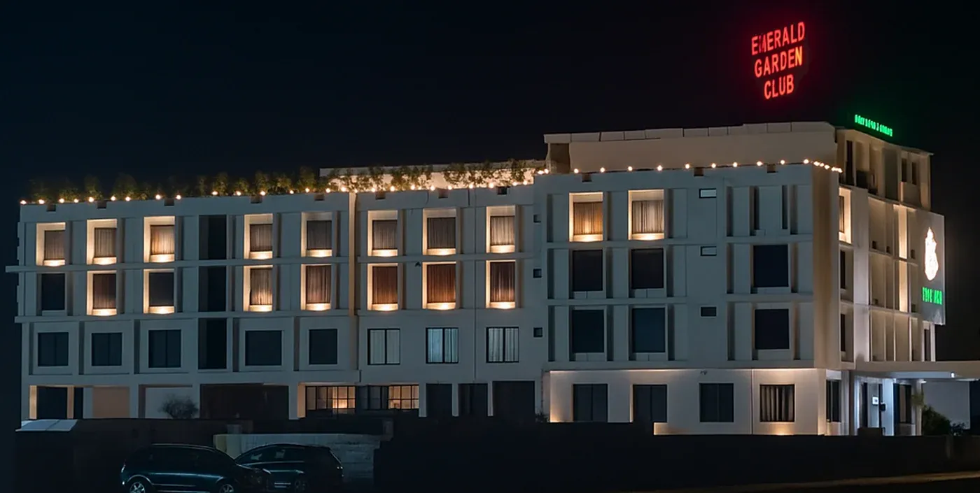 Emerald Garden Club signed exterior at night