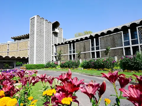 Main building and flower beds — India International Centre