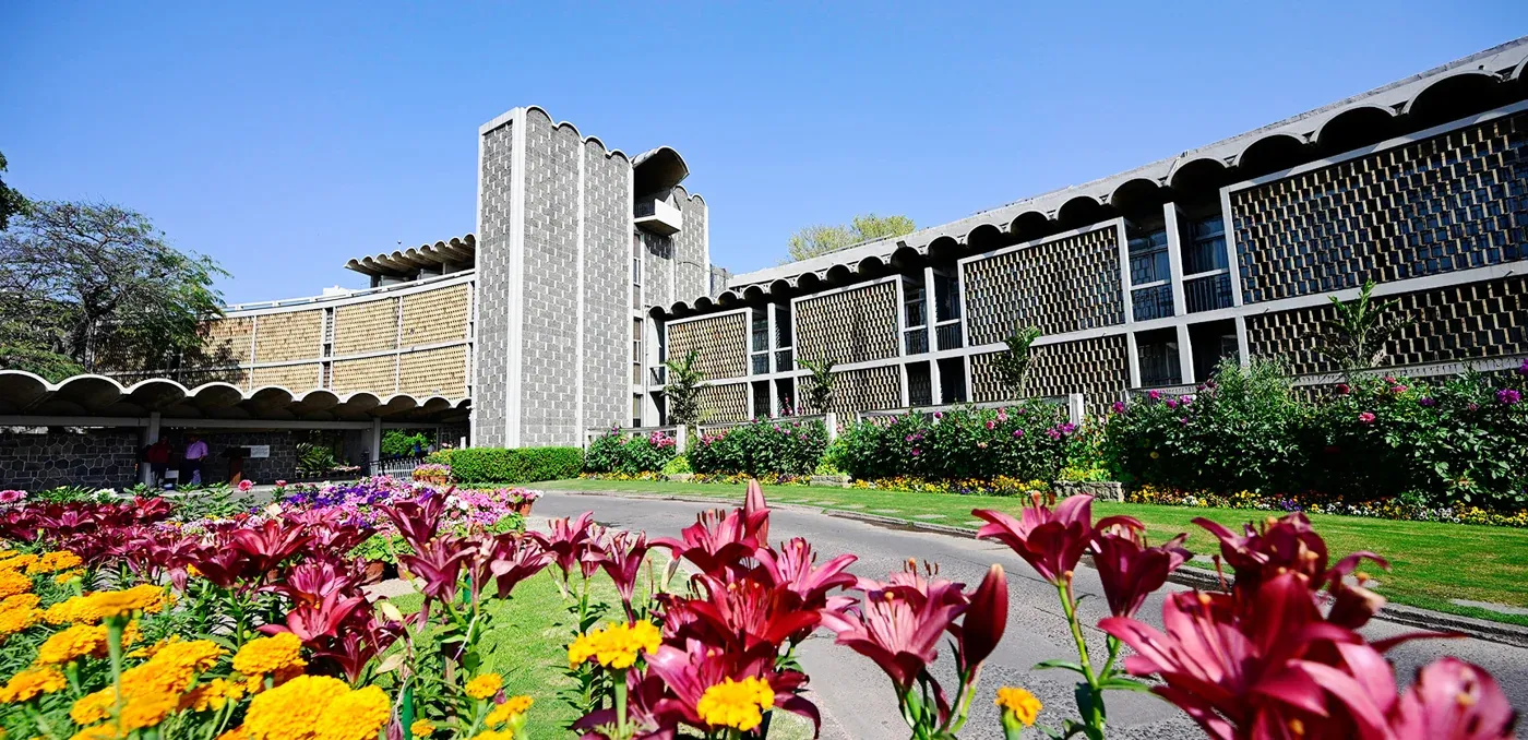 Main building and flower beds — India International Centre