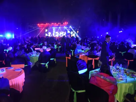 Outdoor evening event and dining setup at Indore Residency Club