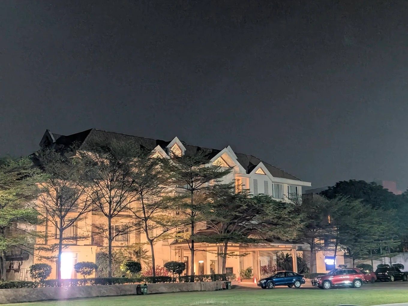 Jubilee Hills International Centre main building and lawn at night