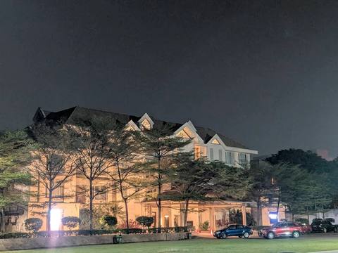 Jubilee Hills International Centre main building and lawn at night