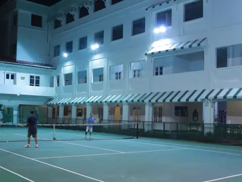 Lotus Club Kochi — tennis court at night
