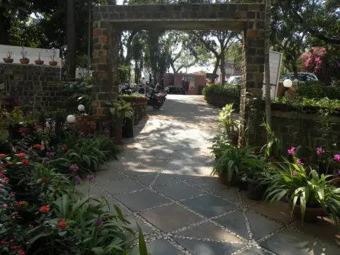 Garden entrance path at Nasiklub