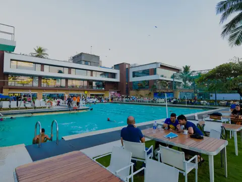 Swimming pool and poolside seating at Otters Club