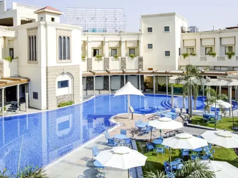 Swimming pool and clubhouse courtyard — The Stellar Gymkhana
