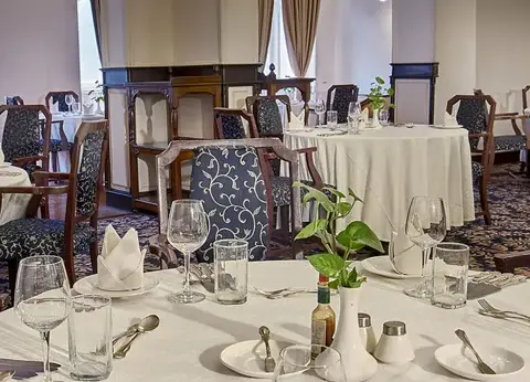 Dining room set for service at The Bengal Club