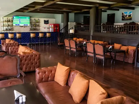Indoor lounge and bar at The Poona Club